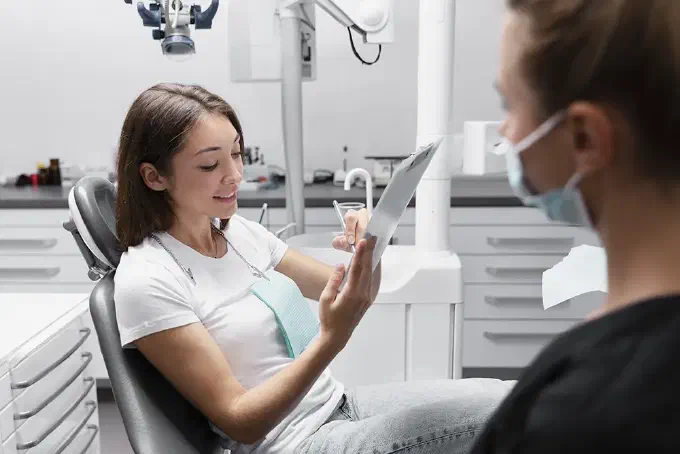 Dental hygienist performing cleaning