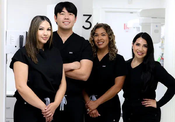 Dr. Sidney Lee with members of the Alta Loma Dental Care team in the office